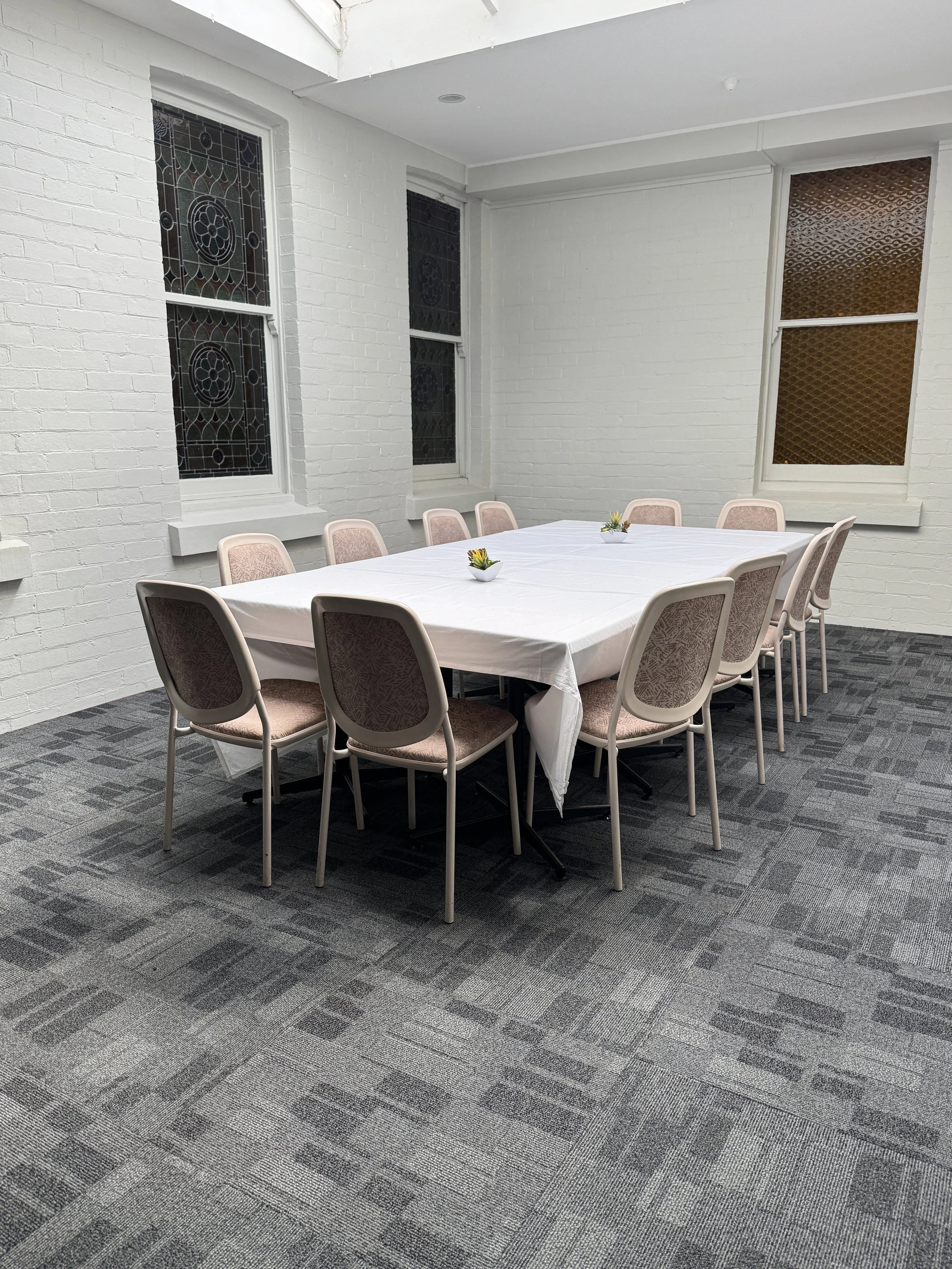 A private function table set inside a bright hotel room